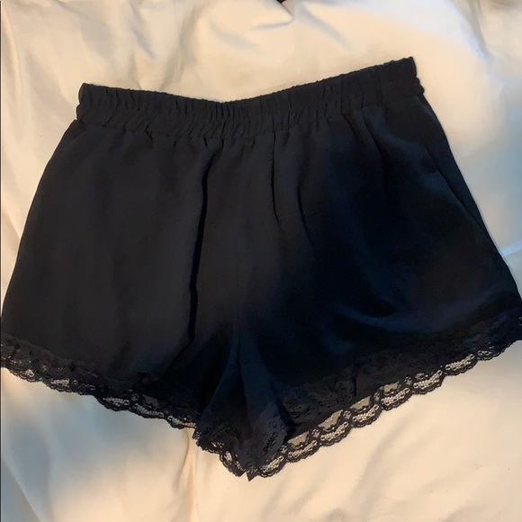 Mid rise black flowy shorts with lace trim - Picture 1 of 2